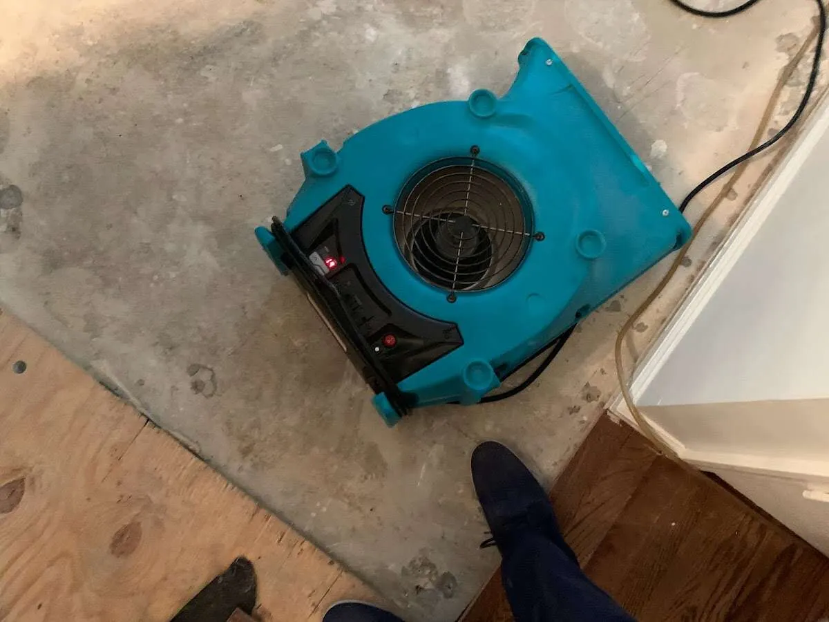 Air mover drying subfloor during Commercial Water Damage Restoration in Skowhegan